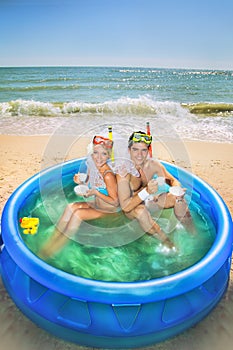 Newly-married couple enjoying on the beach