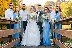 Newly married couple with groomsmen and bridesmaids