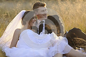 Newly married couple in natural outdoor environment