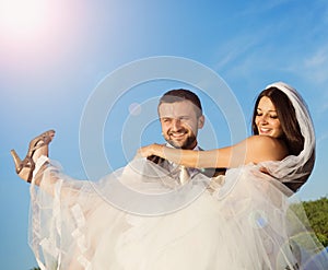 Newly married couple portrait with blue sky