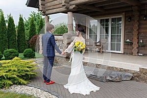 Newly married ready to enter in luxurious wooden mansion