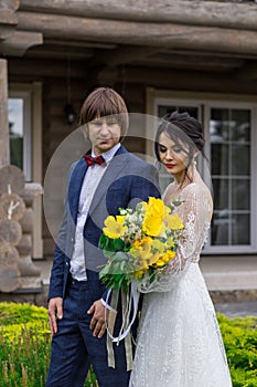 Newly married ready to enter in luxurious wooden mansion