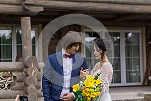 Newly married ready to enter in luxurious wooden mansion