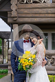 Newly married ready to enter in luxurious wooden mansion