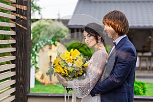 Newly married ready to enter in luxurious wooden mansion