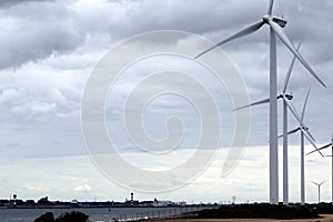 Newly placed windmills on the reclaimed beach of the 2 Maasvlakte. photo