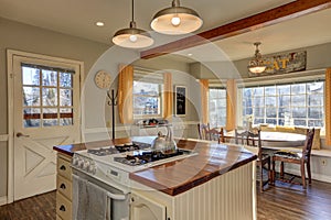 Newly renovated Kitchen and breakfast nook with wood beams on c