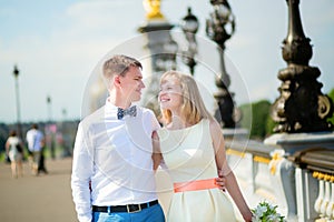 Newly-wed couple on Alexandre III bridge in Paris