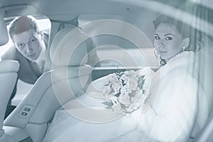 Newly wed couple in car photo