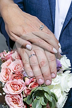 Newly Wed Couple Hands With Wedding Rings