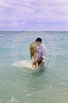 Newly wed couple in the ocean