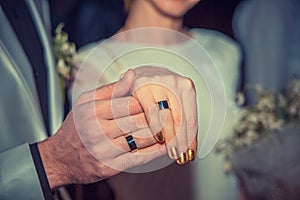 Newly wed couple`s hands with wedding rings. Sign, symbol of new family concept