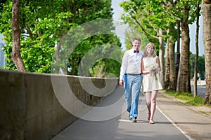 Newly-wed couple walking in Paris