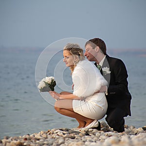 Newly wedded on seashore