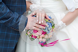 Newly wedded showing own hands with wedding rings