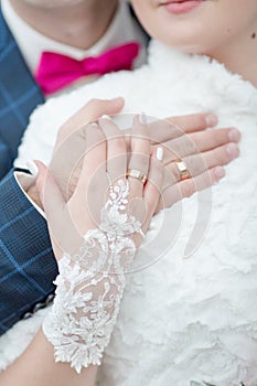 Newly wedded showing own hands with wedding rings photo