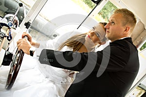 Newlywed couple driving