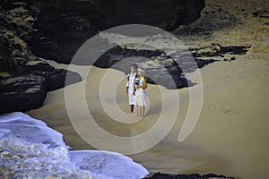 Newlywed couple at Eternity beach