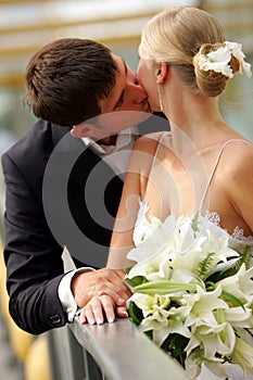 Newlywed couple kissing