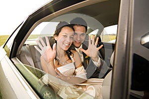 Newlywed couple in limo