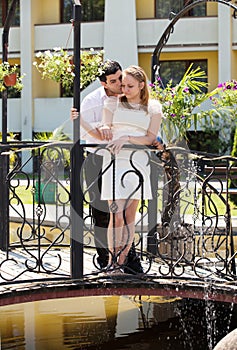 Newlywed couple in love stood on bridge