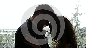 Newlywed couple silhouetted touching foreheads in love, quiet moment, marriage. HD 24FPS.