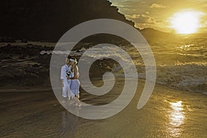 Newlywed couple at sunrise