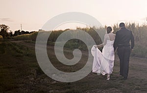 Newlywed couple at sunset