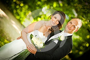 Newlywed portrait of couple with bouquet