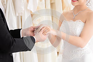 Newlywed or wedding ceremony preparation couple lifestyle concept, Mix race, beautiful Asian girl and Caucasian man eye contact