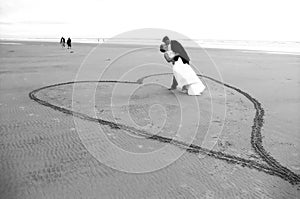 Newlyweds on beach photo