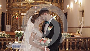 Newlyweds. Caucasian bride and groom together in an old church. Wedding