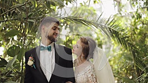 Newlyweds. Caucasian groom with bride in the park. Wedding couple. Happy family