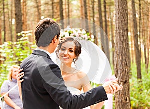 The newlyweds dancing near the wedding arch