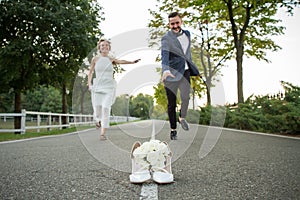 Newlyweds run to distill for a bouquet of brides