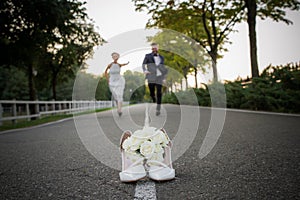 Newlyweds run to distill for a bouquet of brides