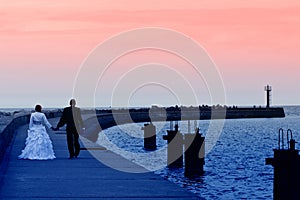 Newlyweds sea sunset walk