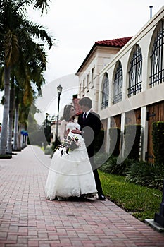 Newlyweds on sidewalk