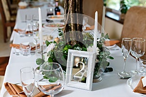 Newlyweds table setting decorated in rustic style. Nature theme in decoration