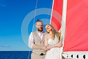 Newlyweds traveling in a sailing boat