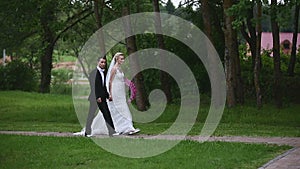 Newlyweds walk in the park