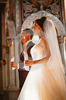 Newlyweds wedding ceremony in the church,wedding ceremony, glans photo