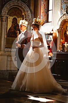Newlyweds wedding ceremony in the church,wedding ceremony, glans photo