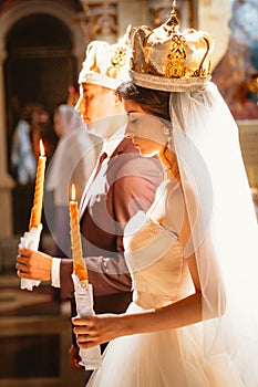Newlyweds wedding ceremony in the church,wedding ceremony, glans photo