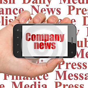 News concept: Hand Holding Smartphone with Company News on display