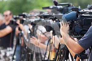 News conference. Filming an event with a video camera.