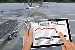 News about financial crisis reading with hand on a computer tablet