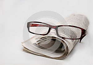 News paper with glasses