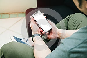 Newsletter concept Hand of young man checking message box on digital mobile phone blank copy space for your text Vintage tone