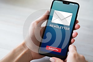 Newsletter subscription button on mobile phone screen. Business marketing concept.